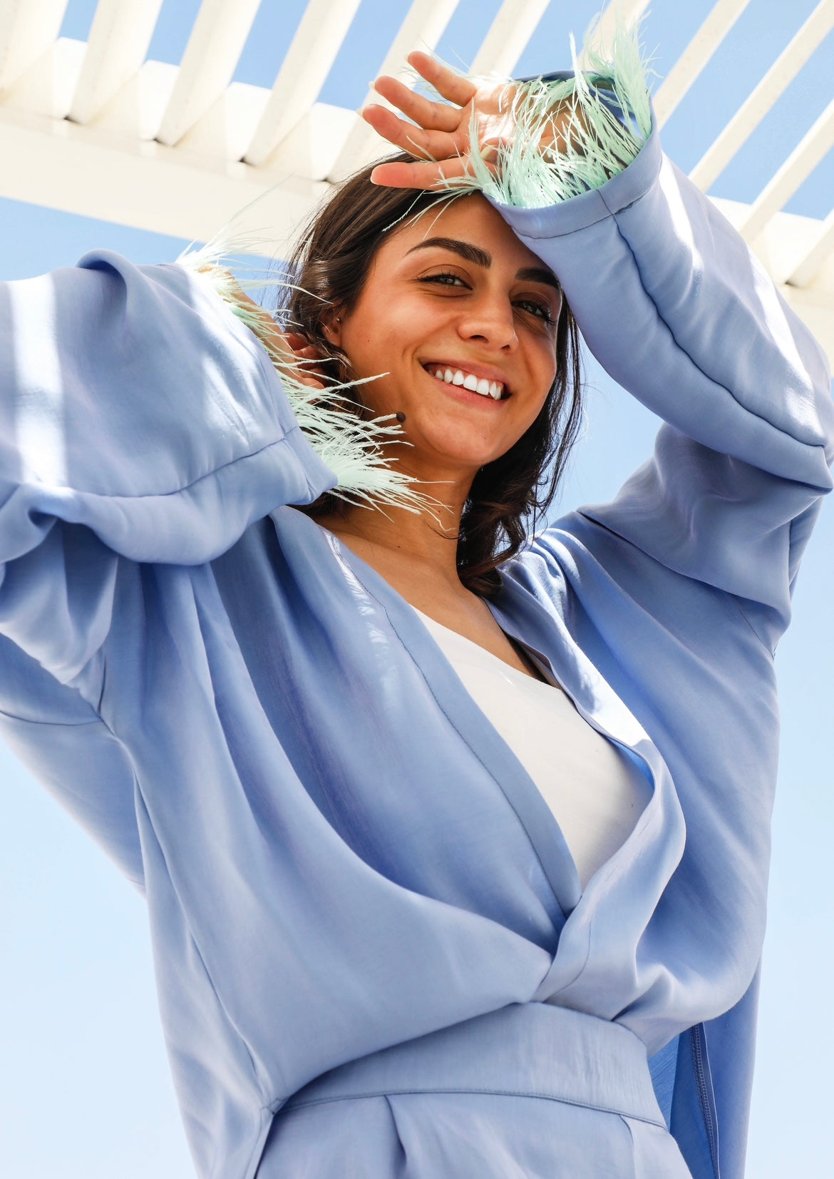 The shimmer draped shoulder with feathers set